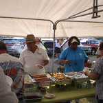 Ray, Bev, and Charles passing out the good chow!