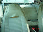 Failed seam in passenger's seat; mildew on seats needs to be cleaned; package tray damaged from leak in sail panel