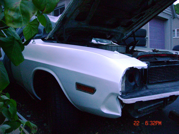 That nasty hole just behind the headlight: gone! The paint is not a perfect match, but it will do for now.