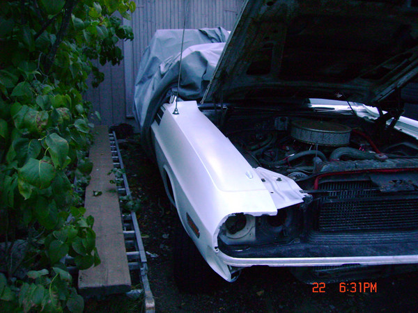 Then body filler, lots of careful sanding, then primer and a few coats of lacquer, wet-sanding between coats.  Why not?!