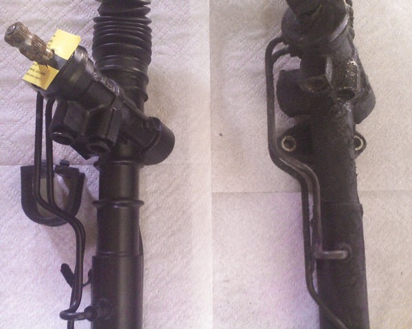 Close-up of the driver's side mounts.  I have no bracket for this second rubber isolator, because my car never had one.  (The  new rack is on the left.)