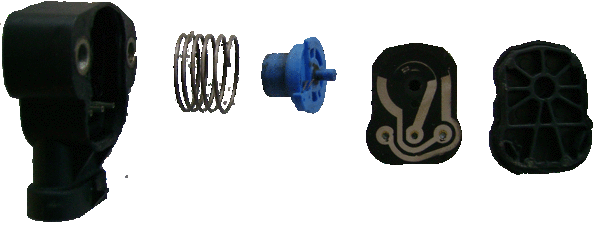 Exploded view of the switch, from the side: housing, coil return spring, potentiometer knob w/ brushes, resistor/circuit "board", cover.