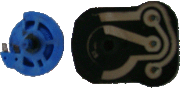 Closeup of the potentiometer components.  Note the worn spots where the brushes contact the inner resistor "track".