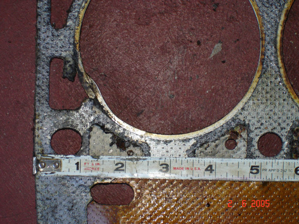 Close-up of the damage to bore #1 (coolant passage into combustion chamber)
