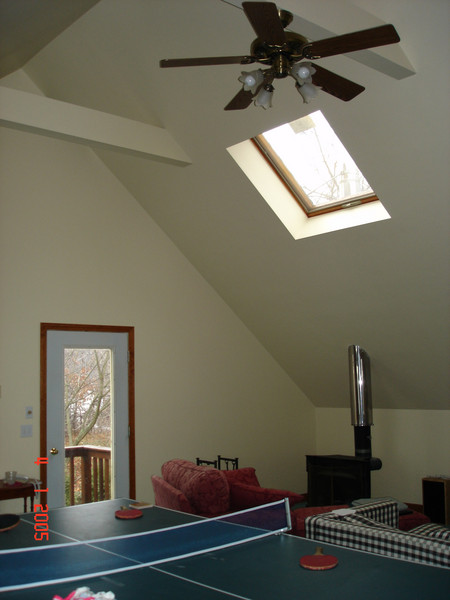 the walls and 16-foot cathedral ceiling were bare plaster.