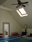 the walls and 16-foot cathedral ceiling were bare plaster.