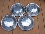 Factory chrome wheel covers from a '71 Chrysler Newport Custom with 15" steel wheels. Excellent condition.