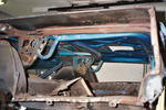 Old rusted quarter and trunk extension removed for replacement.