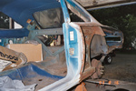 Old rusted outer wheel housing removed.