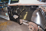 New drivers side outer wheel housing mounted and entire area has POR-15 applied.