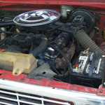 Driver's side motor. Correct carb, breather, tubes, valve covers, exhaust manifolds. Stock as it should be.