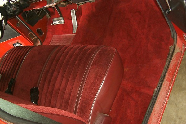 Passenger's side. Carpet is cut and sewn, not molded. Seat is in nice shape