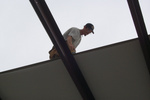 "Skinny" at work on the roof
