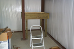 After much gruntin and groanin it's standing in place....(if interested, it is 4'6" X 4'6" X 53" and is made of 2X12s, 2X4s, 3/4" decking, and 4X4 posts)