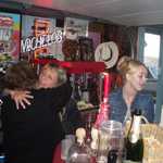 Hugs were all around at the party. Funny how good champange will do that to some people.