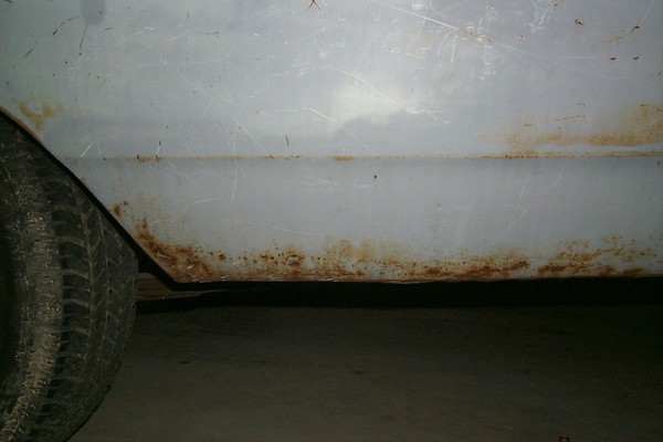 Worst rust on the car. Driver's side lower quarter