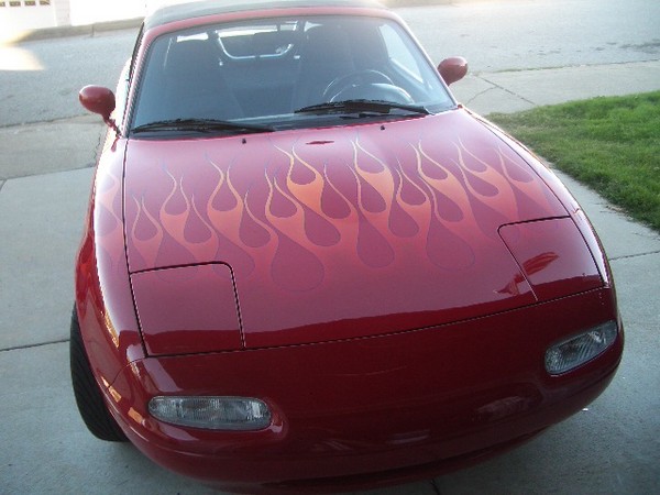 The Miata gets some new flames. 10-2006