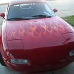 The Miata gets some new flames. 10-2006