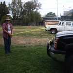 Fred ropes off the feild for the cars that will fill the place tommorow.