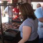 Sally jumps right in and helps us do the cooking.