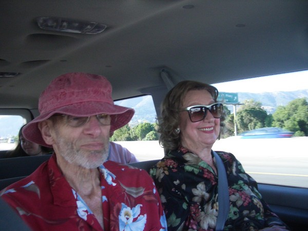 We hit the road in a rented van. My mom looks happy to be in on our way.