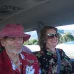 We hit the road in a rented van. My mom looks happy to be in on our way.