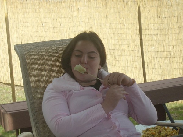 Deanna has a fruit shiskabob.