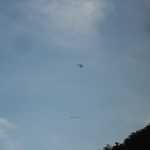 We pass quite a few hand gliders on the way home.