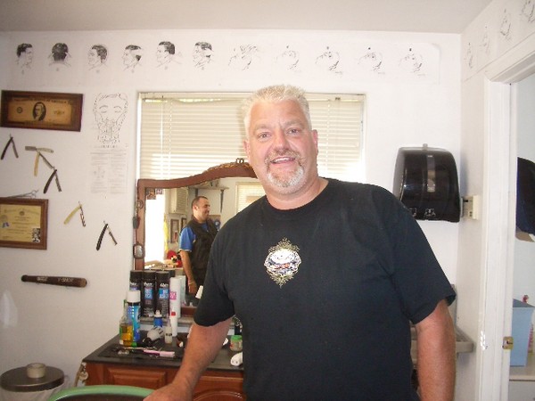 Fidel the barber gives me the "High and Tight" $8 haircut.