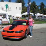 Caitlin poses with her dream car.