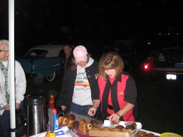 Joann and Cindy lay out the breakfest foods.