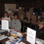 The ladies of the Golden State Rods pitch in to get us all signed in.