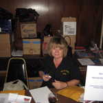 Diane Rivers puts in a long day after a long night of finishing up for the event.
