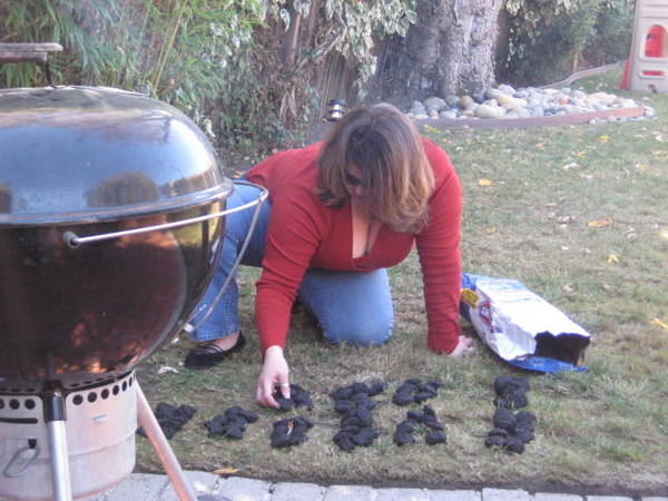 Sally counts out the charcoal. Seems we have just enough for one 25lb turkey.