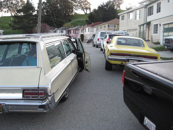 The Widman's arrive in their cool Mopar wagon.