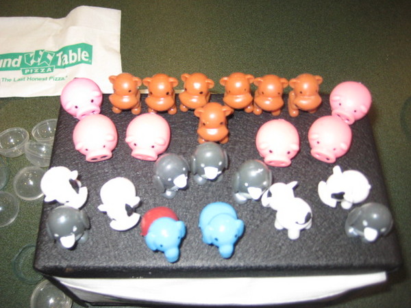 The penguins are out numbered by the pigs and monkeys.