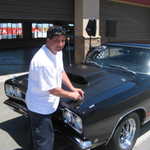 Herb buttons down the hood for the ride home.