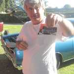 John shows us a card of his car.