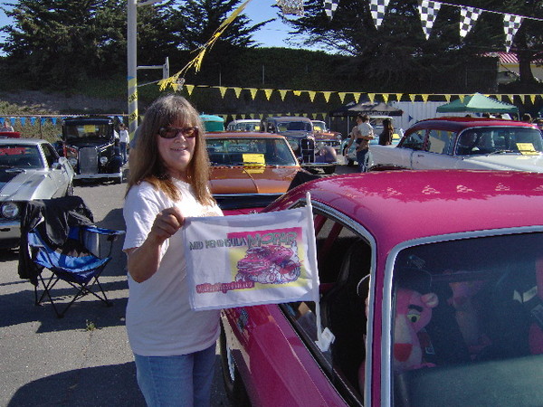 Welcome to the St.Veronica's 2008 car show. Kathy shows off the last remaining origial MPM window flag.