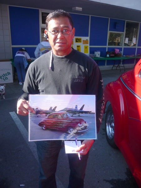 Tim shows off this great photo of his car next to the Blue Angels.