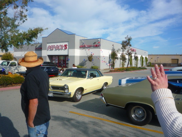 Here come Jim and Thelma in their non convertible GTO.