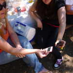 Caitlin and Deanna compare phones.