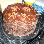 Cake says "Welcome Moparts members" either that or "This cake is poisoned". Hard to say as i don't read Chinese.