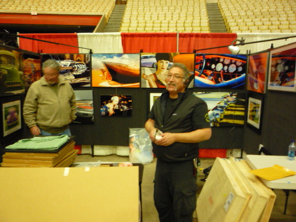 Phil Hall sets up his booth to show off his very cool art.
