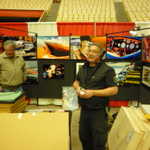Phil Hall sets up his booth to show off his very cool art.