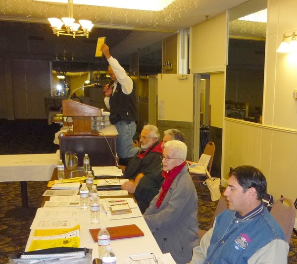 Carl makes the anouncement at the March club meeting.