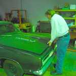 Sandy opens the bonnet to his new 68 'Cuda.