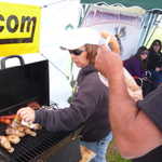 Joann pitches in to help with the grilling duties.