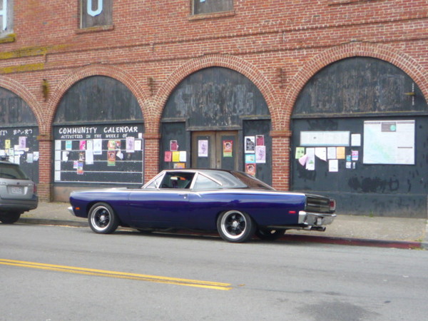 Gratuitous shot of my roadrunner in front of a neat old building.