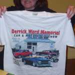 Cindy holds up the 2009 Derrick Ward Memorial car show T-shirt